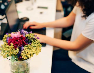 woman-at-the-office-with-flowers-on-her-desk-2022-11-08-08-59-02-utc (1)
